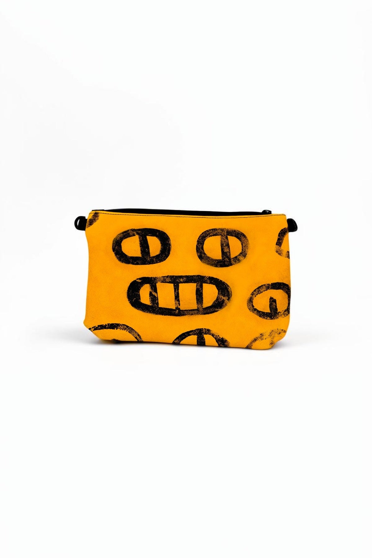 TWINBULL yellow leather Pouch No. 007 with black hand-painted graphics, a raised honeycomb monogram, black zipper, and camo lining.