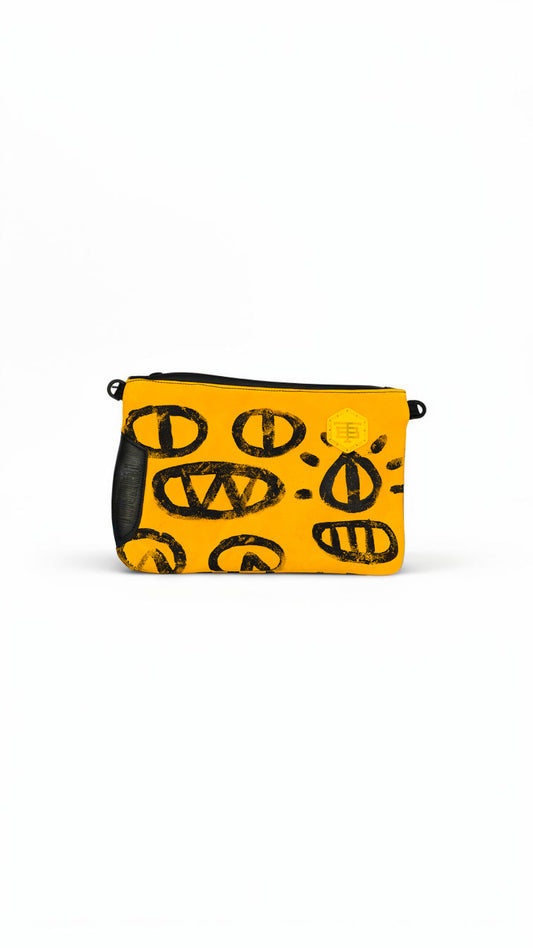 TWINBULL Pouch No.007, a one of one hand painted yellow leather pouch with black Studio Marks artwork.